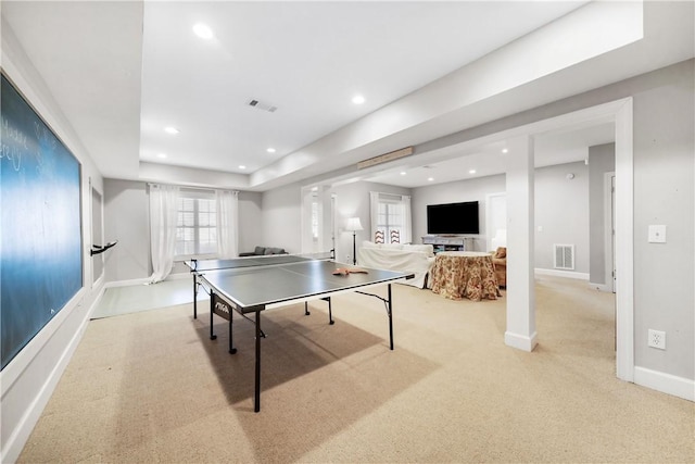 rec room featuring ornate columns and light colored carpet