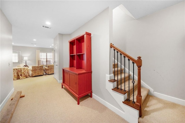 stairway with carpet floors