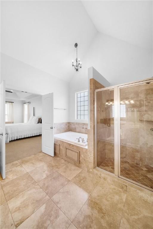 bathroom with a notable chandelier, high vaulted ceiling, and independent shower and bath