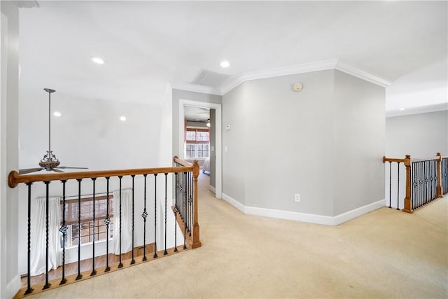 hall featuring crown molding and light carpet