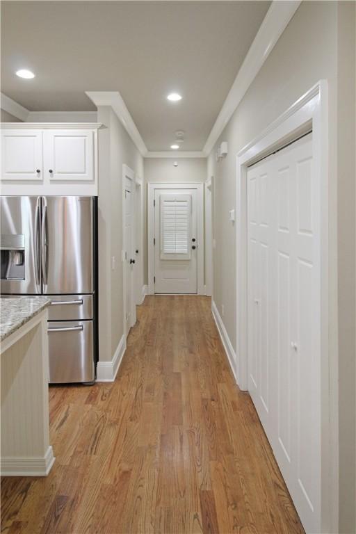 2904 Lone Eagle Ln, Opelika, AL 36801 - corridor with light wood-type flooring, baseboards, recessed lighting, and ornamental molding