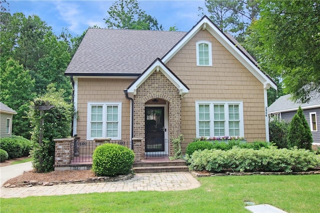 2904 Lone Eagle Ln, Opelika, AL 36801 - view of front of home with a front lawn and a shingled roof