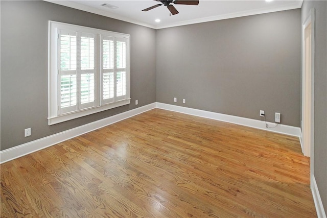 2904 Lone Eagle Ln, Opelika, AL 36801 - spare room featuring a ceiling fan, wood finished floors, baseboards, and ornamental molding