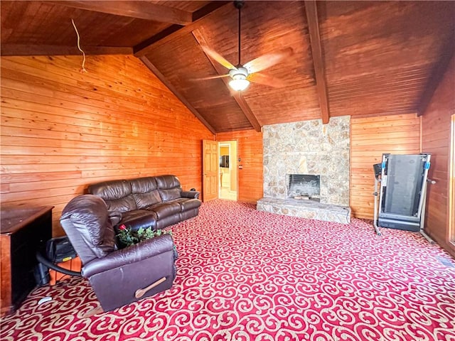 living room with vaulted ceiling with beams, wood walls, wooden ceiling, and ceiling fan