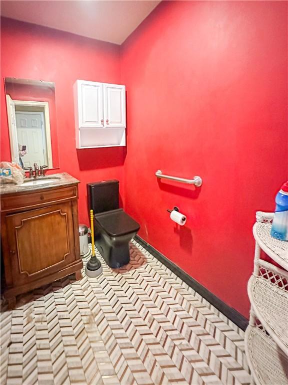 bathroom featuring vanity and toilet