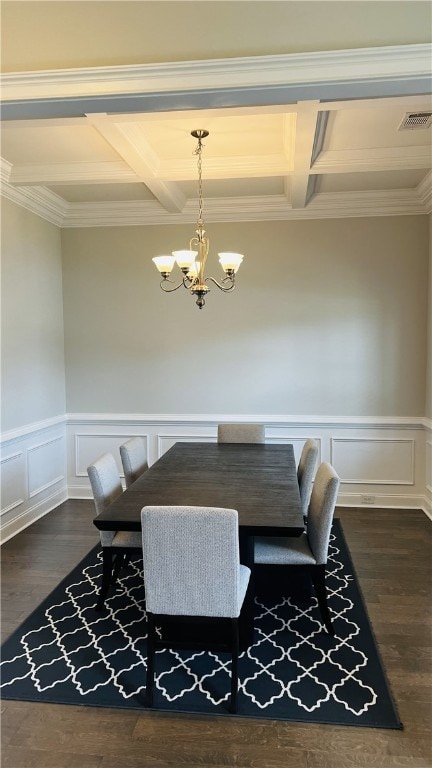 dining space with an inviting chandelier, ornamental molding, beam ceiling, and coffered ceiling