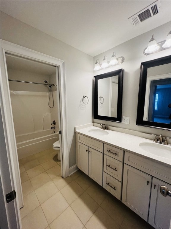 full bathroom featuring toilet, vanity, bathing tub / shower combination, and tile patterned floors