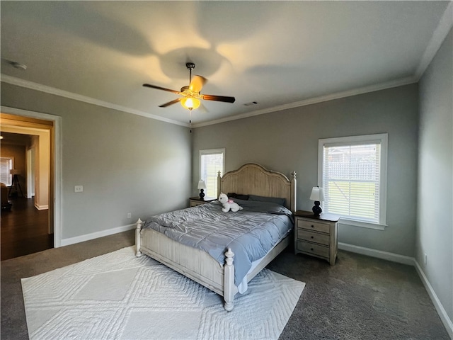 carpeted bedroom featuring ceiling fan and ornamental molding