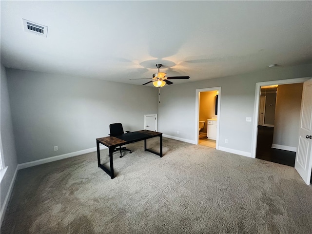 office space featuring ceiling fan and carpet