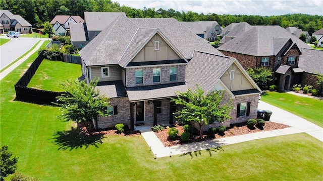 english style home featuring a front yard