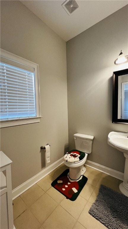 bathroom featuring tile patterned floors and toilet