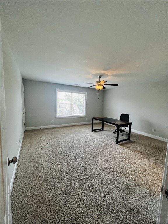 unfurnished room with ceiling fan and carpet floors