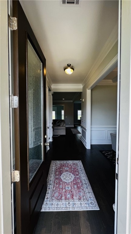 hallway featuring crown molding and dark wood-type flooring