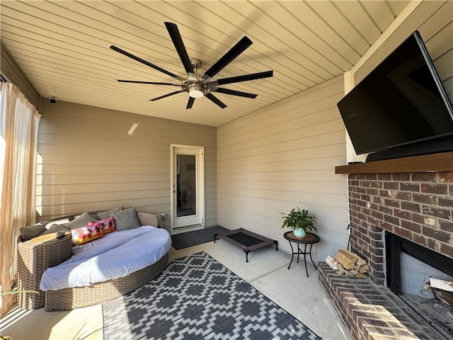 view of patio with an outdoor living space and a ceiling fan