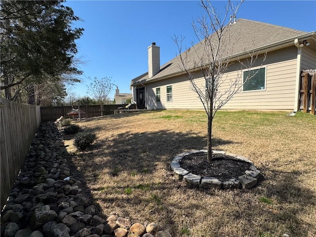 exterior space with a fenced backyard