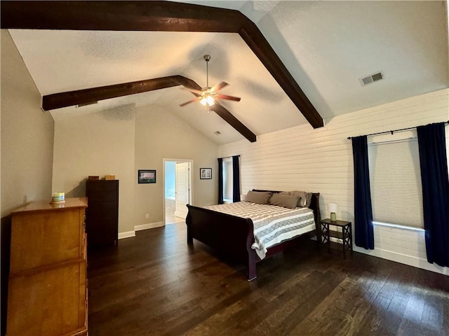 bedroom with a ceiling fan, vaulted ceiling with beams, wood finished floors, baseboards, and visible vents