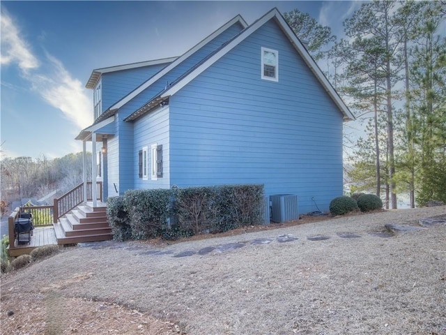 view of side of property with central AC unit