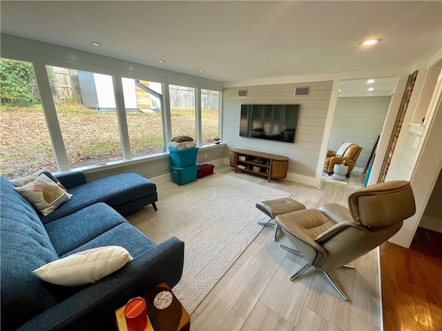 living area featuring recessed lighting and visible vents