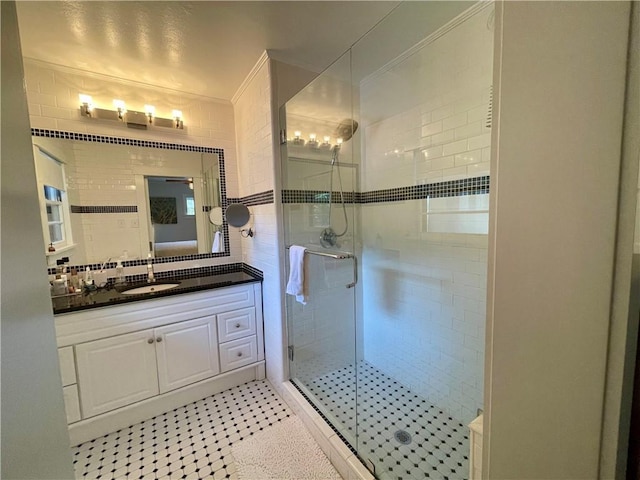 bathroom featuring a stall shower, ornamental molding, backsplash, and vanity