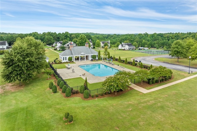 view of pool featuring a yard