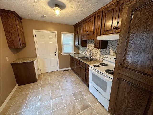 kitchen featuring backsplash, electric stove, sink, a textured ceiling, and light tile patterned flooring