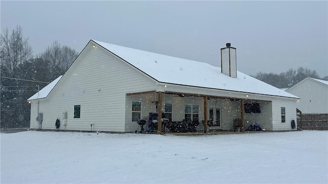 view of snow covered house