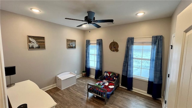 interior space featuring dark hardwood / wood-style floors and ceiling fan