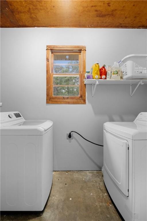 clothes washing area featuring washing machine and dryer