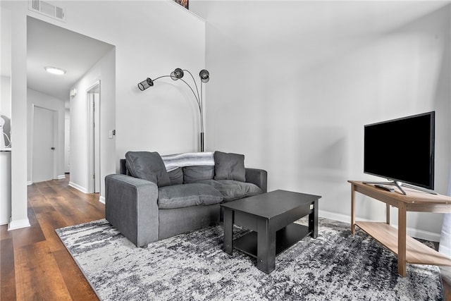 living room with dark hardwood / wood-style floors