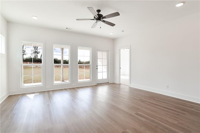 1013 Crossing Ct E, Valley, AL 36854 - spare room featuring healthy amount of natural light, wood finished floors, recessed lighting, and ceiling fan