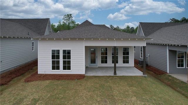1013 Crossing Ct E, Valley, AL 36854 - rear view of property with a patio, a lawn, and roof with shingles