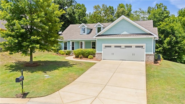 4112 Creekview Ct, Auburn, AL 36832 - view of front of house with brick siding, a garage, a front yard, and driveway
