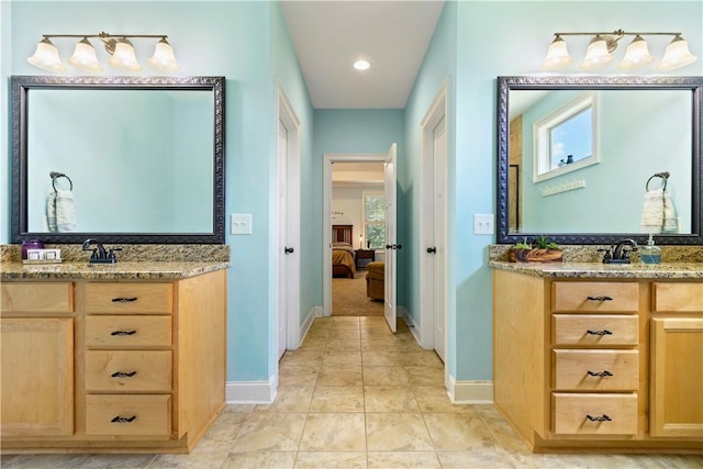 4112 Creekview Ct, Auburn, AL 36832 - ensuite bathroom with two vanities, tile patterned flooring, and recessed lighting