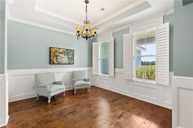 4112 Creekview Ct, Auburn, AL 36832 - living area with a chandelier, wood-type flooring, a wainscoted wall, a raised ceiling, and ornamental molding