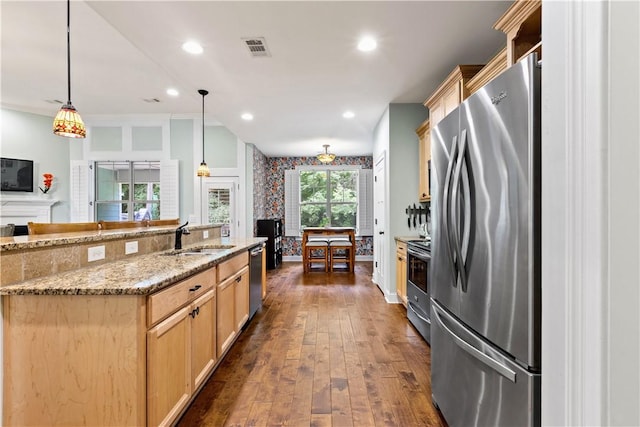 4112 Creekview Ct, Auburn, AL 36832 - kitchen featuring stainless steel appliances, light brown cabinetry, dark wood finished floors, decorative light fixtures, and recessed lighting