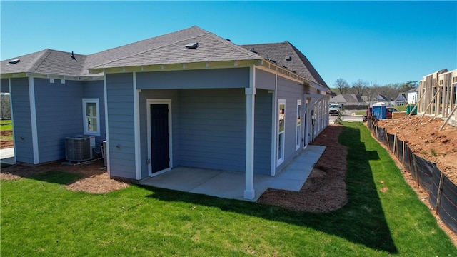 085 Bradley Ln, Auburn, AL 36830 - rear view of property with a patio, central air condition unit, and roof with shingles