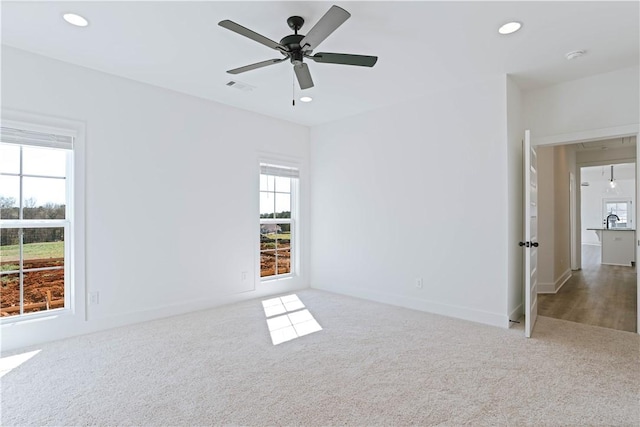 085 Bradley Ln, Auburn, AL 36830 - empty room featuring carpet floors, recessed lighting, a ceiling fan, a sink, and baseboards