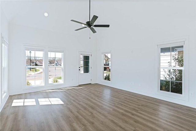 085 Bradley Ln, Auburn, AL 36830 - unfurnished living room with wood finished floors, a ceiling fan, baseboards, and high vaulted ceiling