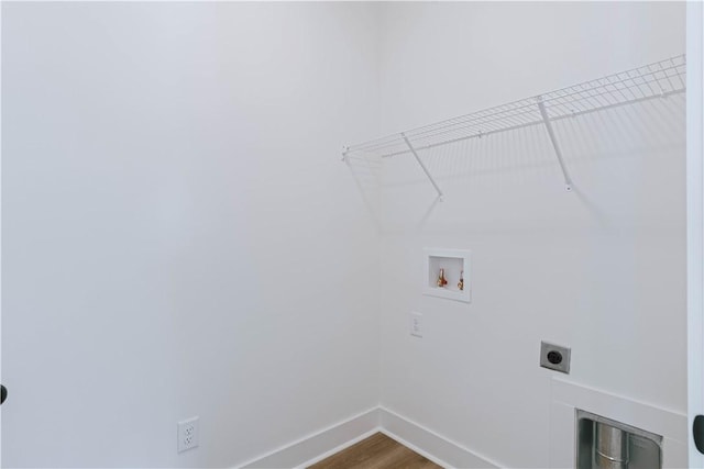 085 Bradley Ln, Auburn, AL 36830 - laundry room featuring hookup for an electric dryer, hookup for a washing machine, baseboards, and dark wood-style flooring
