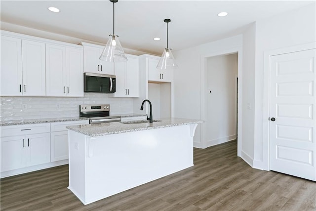 085 Bradley Ln, Auburn, AL 36830 - kitchen featuring appliances with stainless steel finishes, a sink, white cabinetry, decorative backsplash, and recessed lighting