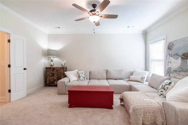 living room featuring light colored carpet, ceiling fan, and crown molding