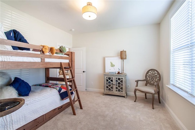 bedroom with light carpet