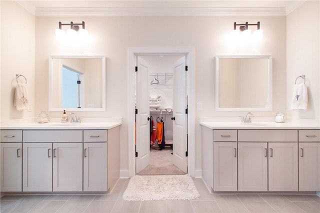 bathroom with tile patterned floors, vanity, and ornamental molding