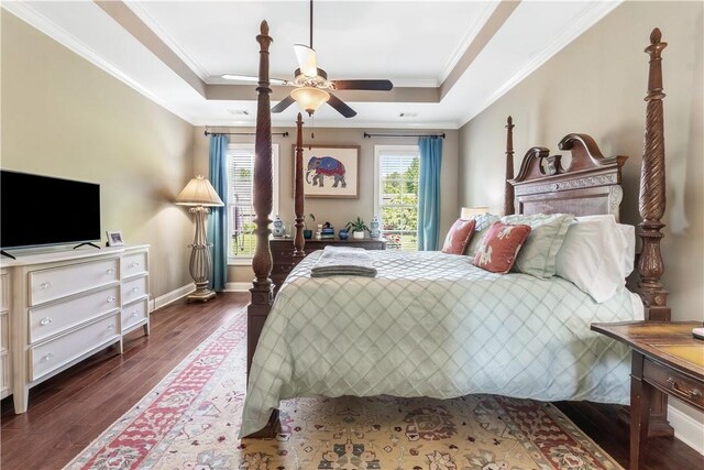 1895 Talcott Ct, Auburn, AL 36830 - bedroom featuring a raised ceiling, crown molding, dark wood finished floors, and a ceiling fan