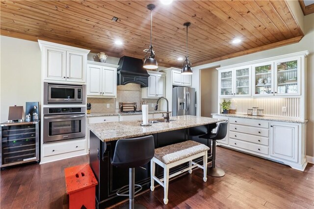 1895 Talcott Ct, Auburn, AL 36830 - kitchen featuring stainless steel appliances, beverage cooler, premium range hood, wooden ceiling, and white cabinets