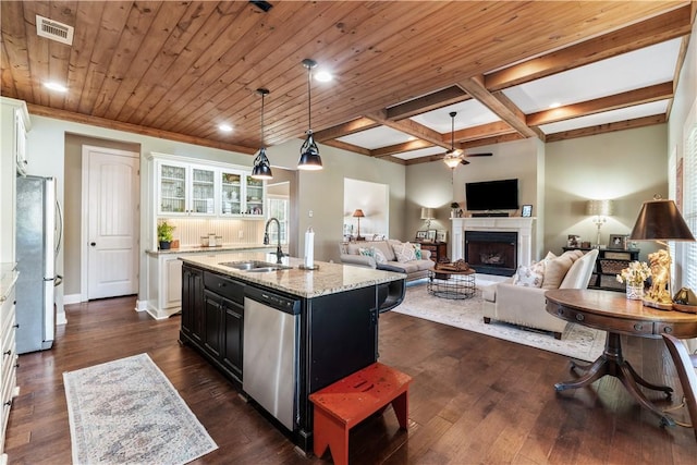 1895 Talcott Ct, Auburn, AL 36830 - kitchen featuring stainless steel dishwasher, freestanding refrigerator, ceiling fan, a fireplace, and a kitchen island with sink