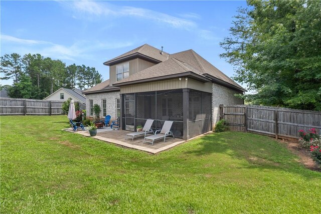 1895 Talcott Ct, Auburn, AL 36830 - back of property featuring a sunroom, a patio, a fenced backyard, roof with shingles, and brick siding