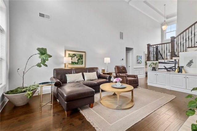 2217 Morgan Dr, Auburn, AL 36830 - living room featuring a high ceiling, stairway, and wood-type flooring