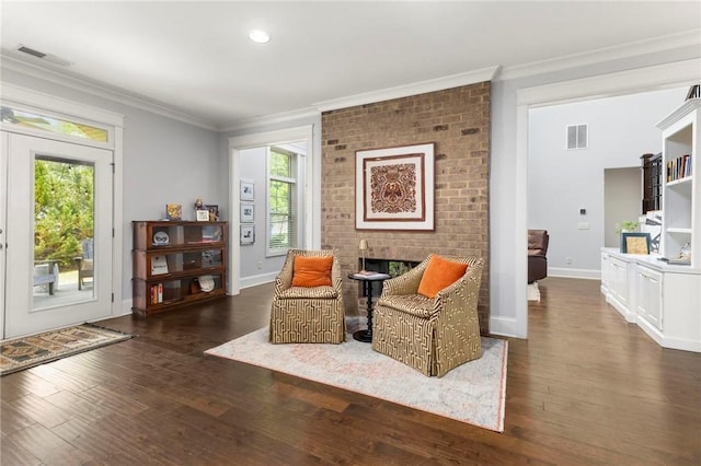 2217 Morgan Dr, Auburn, AL 36830 - sitting room with ornamental molding, dark wood-style flooring, plenty of natural light, a fireplace, and baseboards