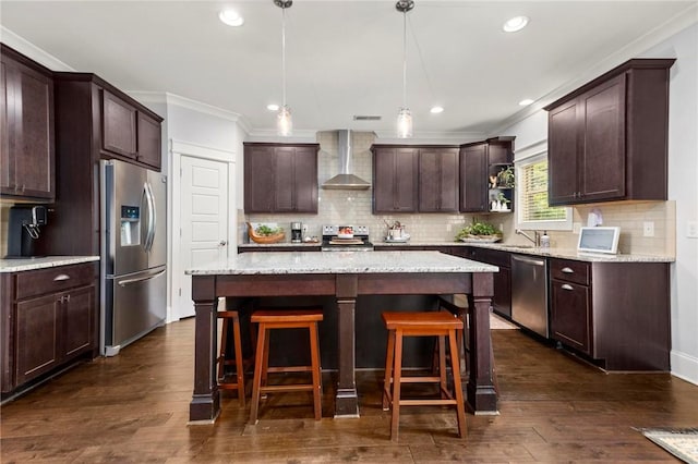 2217 Morgan Dr, Auburn, AL 36830 - kitchen with appliances with stainless steel finishes, wall chimney exhaust hood, ornamental molding, dark brown cabinets, and decorative backsplash